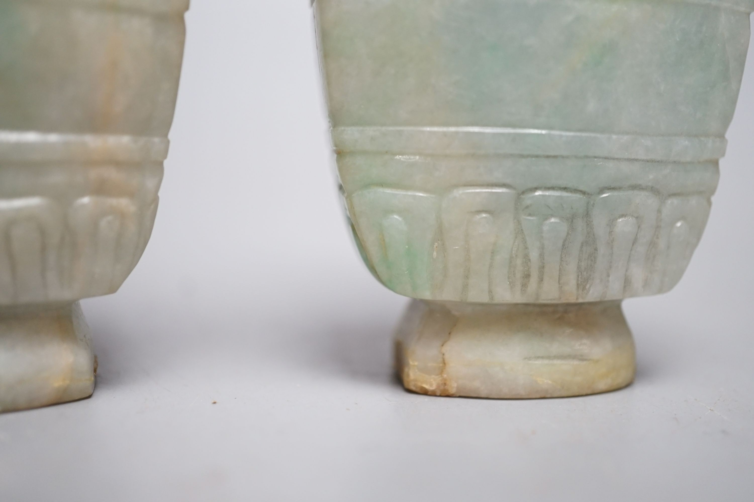 A pair of Chinese jadeite carved vases and covers